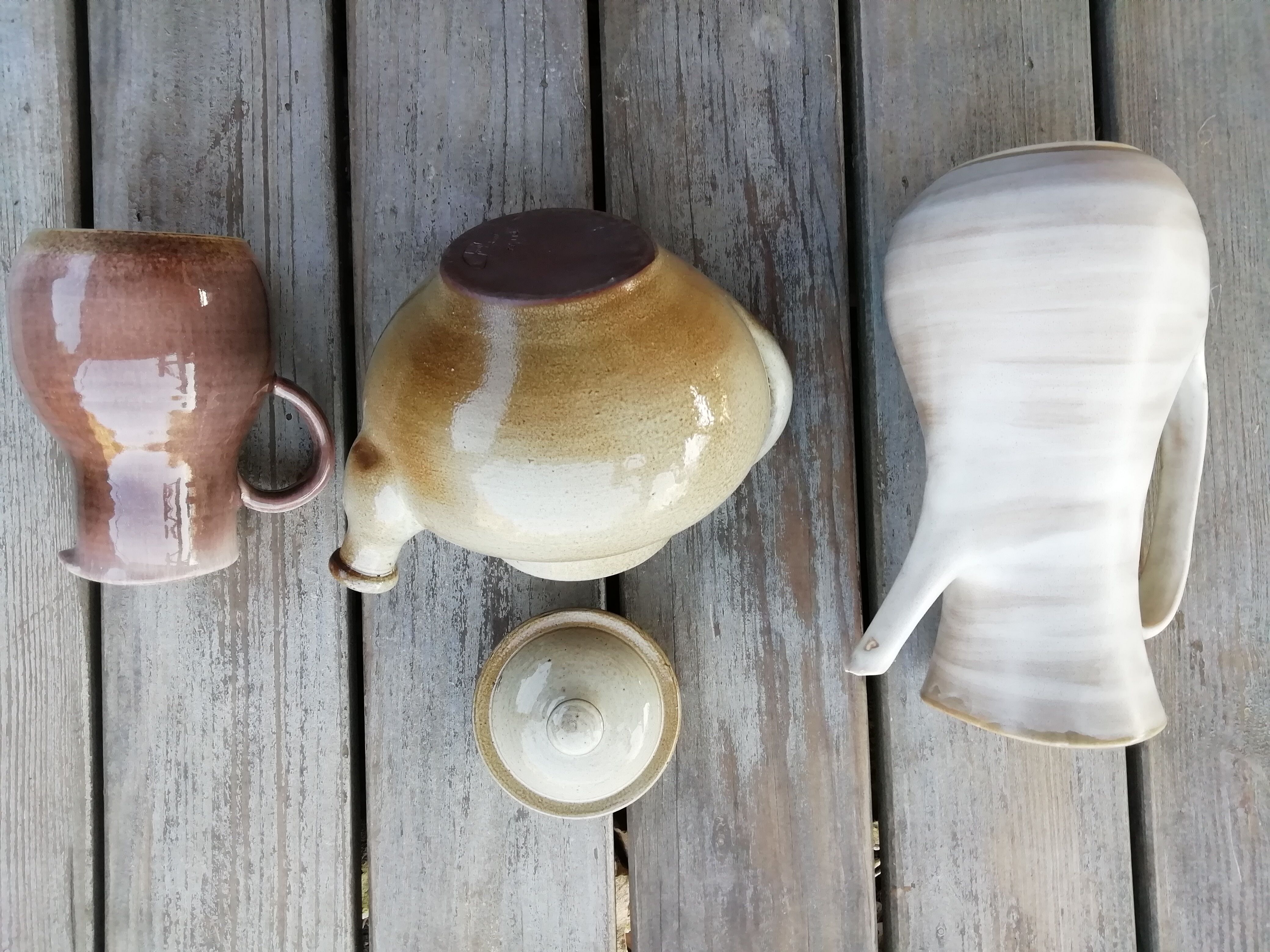 Trio of artisan sandstone teapots