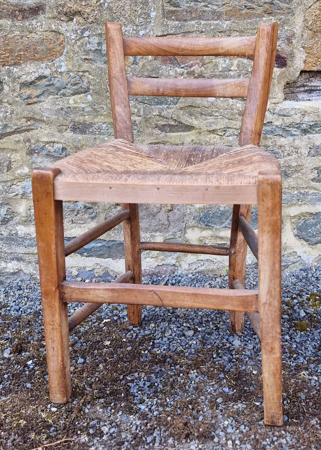 Antique straw chair with low back