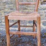 Antique straw chair with low back