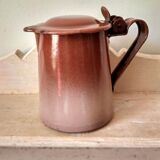 Old pitcher in brown enamelled sheet metal, spout and lid