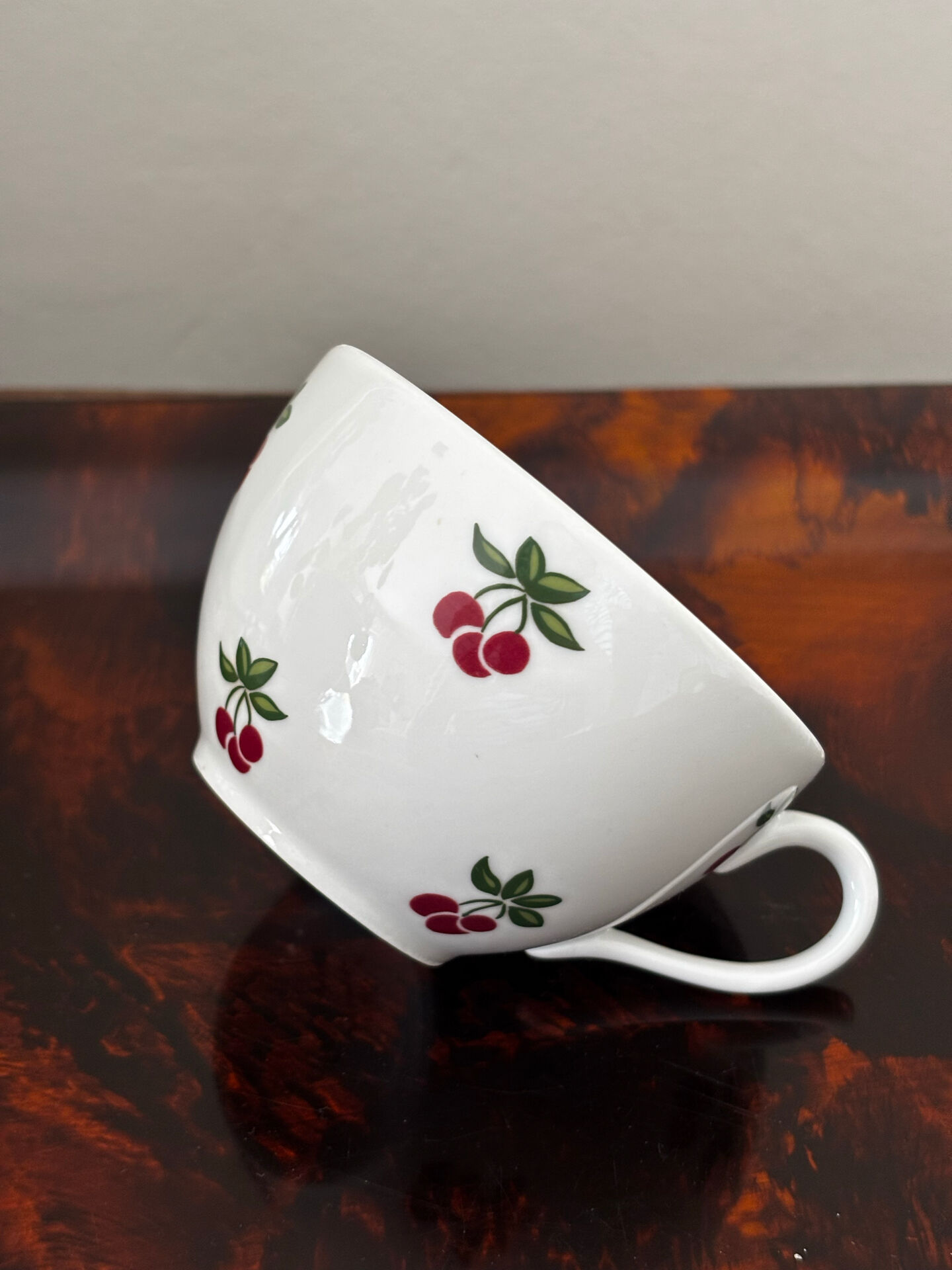 Magnificent teapot and fine porcelain cup set by Pillivuyt with cherries.
