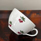 Magnificent teapot and fine porcelain cup set by Pillivuyt with cherries.