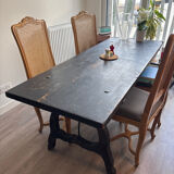 Solid wood farmhouse table with ebony finish.