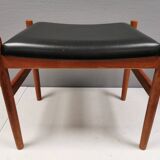 Danish designed footstool in teak wood and black skai “imitation leather”
