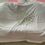 Hand-embroidered tablecloth on rectangular thread canvas