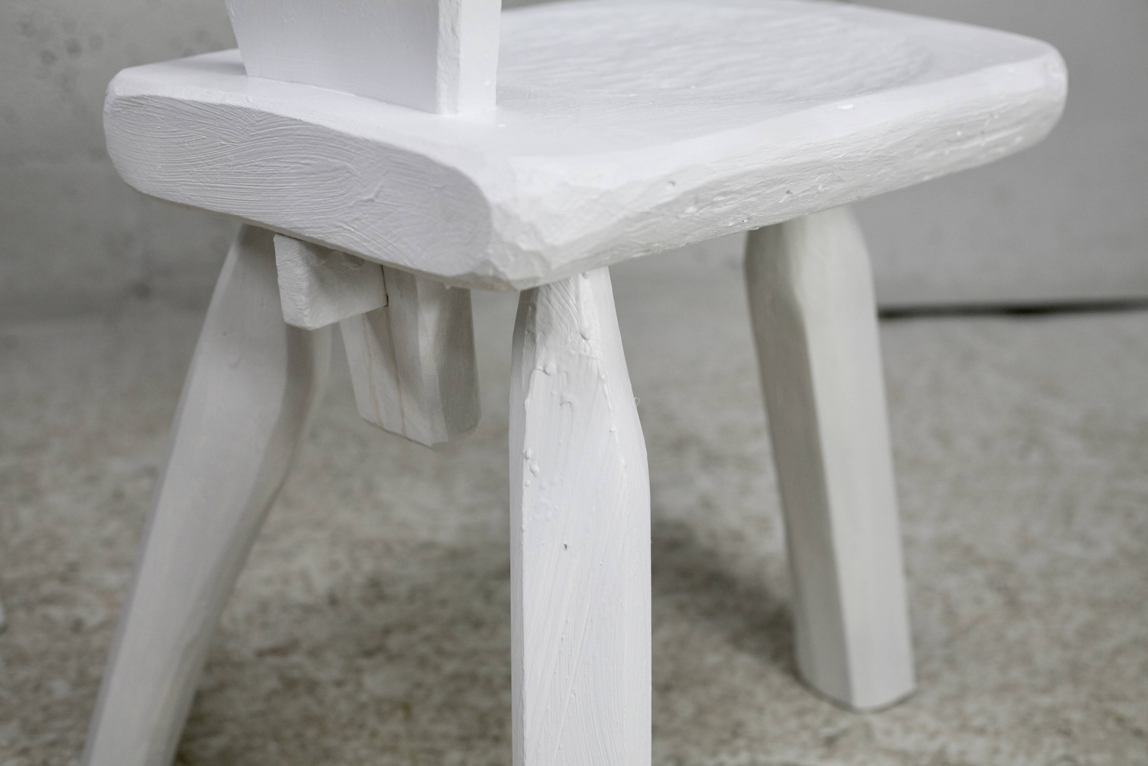 Pair of tripod chairs, gouged seats. Brutalist, circa 1960. Painted wood.