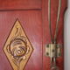 Red wooden wall-mounted coat rack and Art Deco mirror
