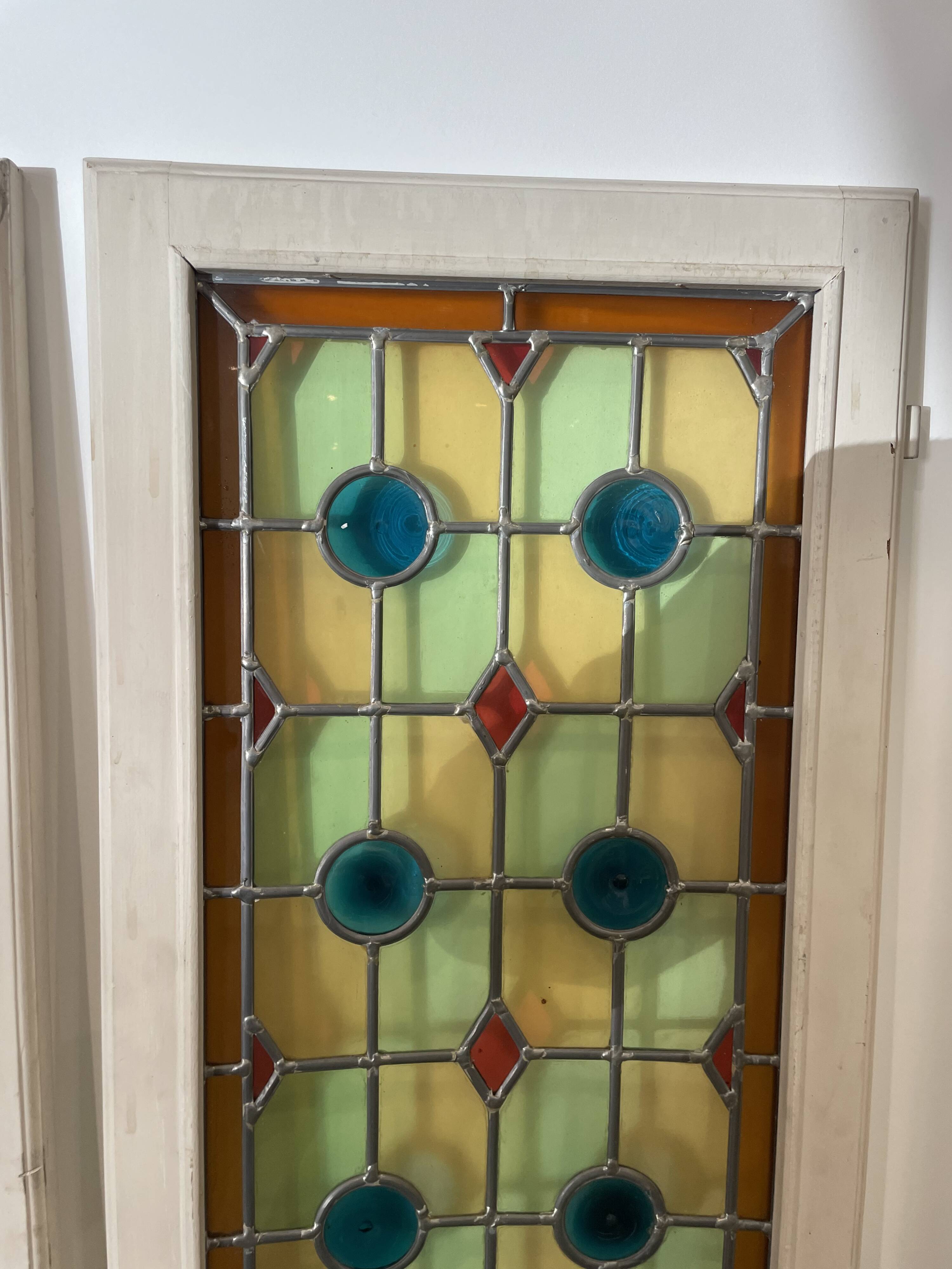 4 vintage faux stained glass panels that can form a screen or a partition