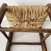 Small rustic vintage wooden and straw stool -