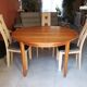 Round extendable teak dining table from the 60s