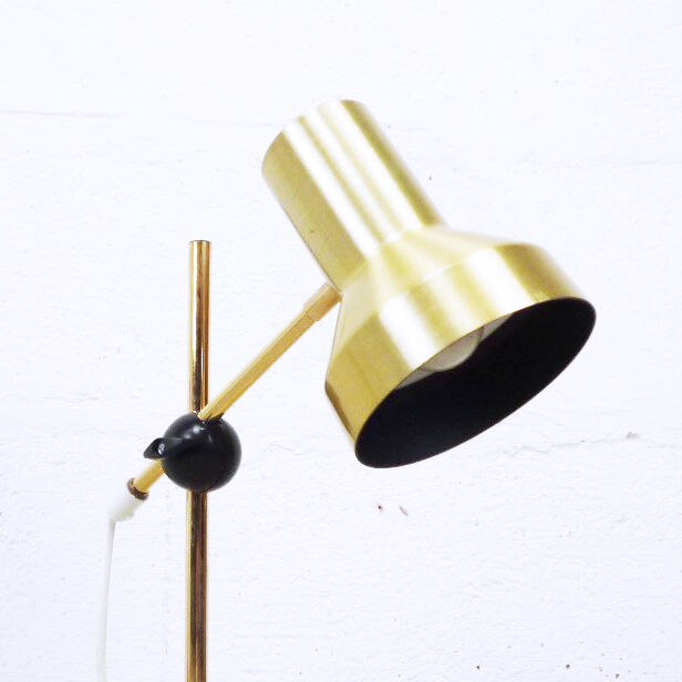 Articulated golden metal table lamp