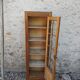 Showcase an old door, small bookshelf.