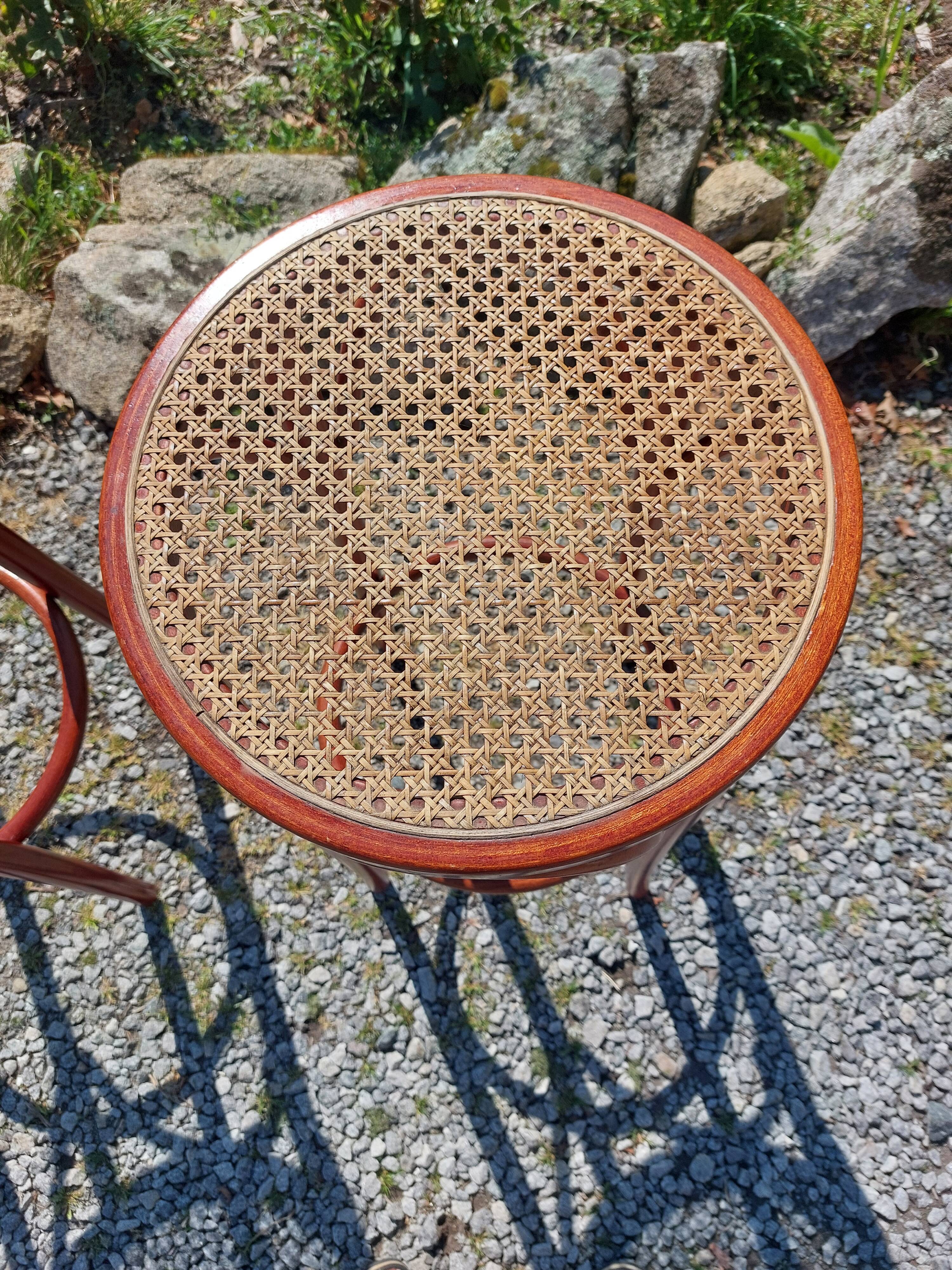 3 wooden and cane bar stools