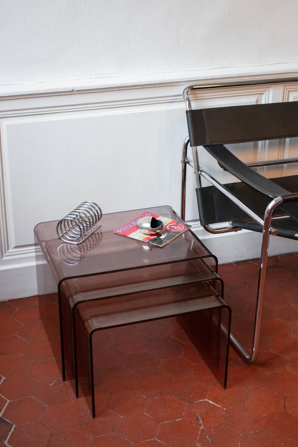 Vintage trio of nesting tables in smoked plexiglass by Michel Dumas, year.