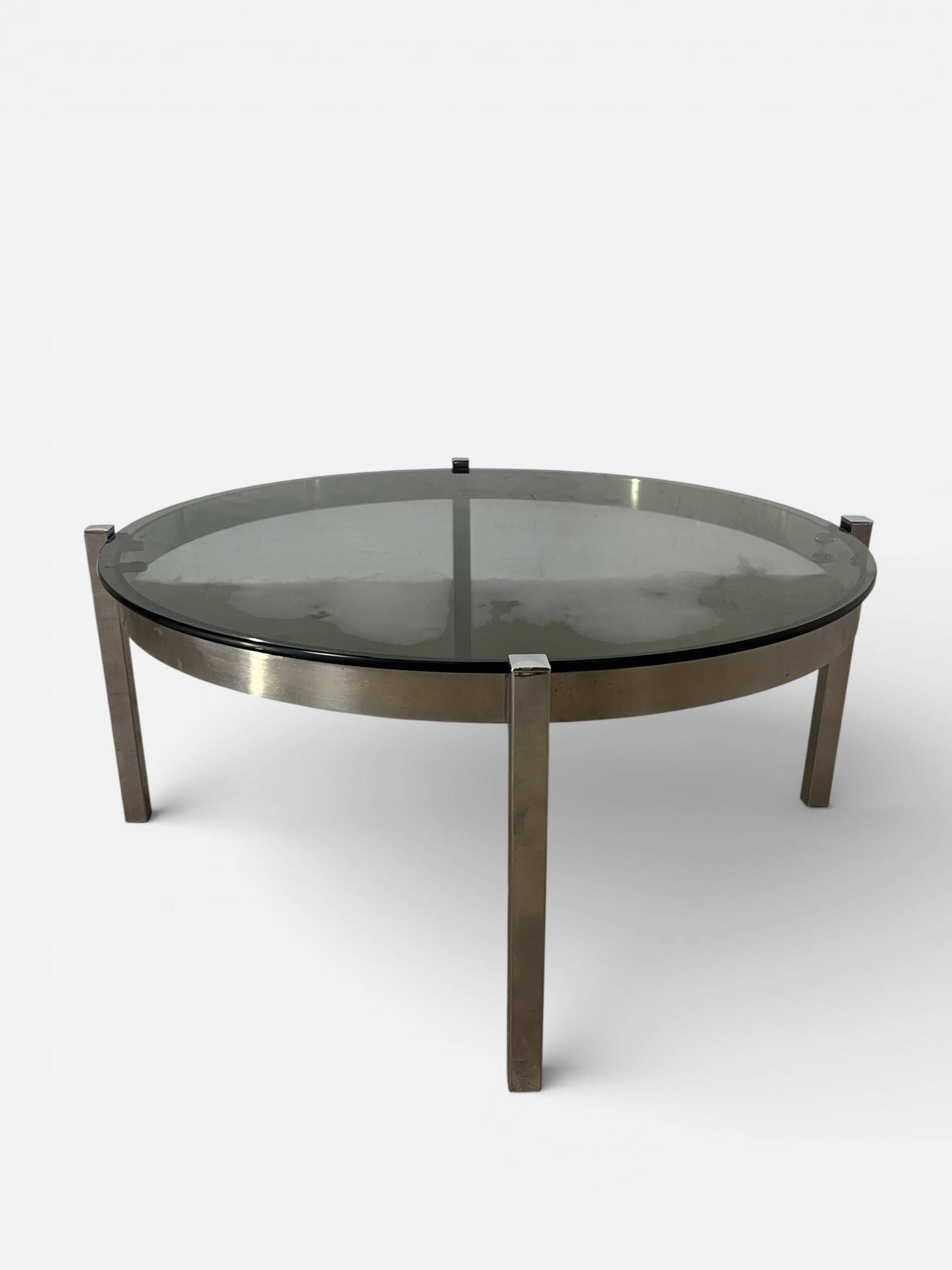 Vintage round coffee table with smoked glass and chrome.