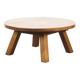 Large rustic vintage coffee table in a round brutalist style.