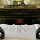 Chinese black wood table inlaid with mother-of-pearl featuring a relief scene of a crane.