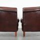 Set of two cow leather club armchairs in a luxurious red/brown colour