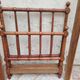 Child's bed or vintage rest bed made of solid cherry wood in a bamboo style.