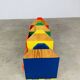 Modular wall-mounted pencil shelf in Pierre Sala style, for children.
