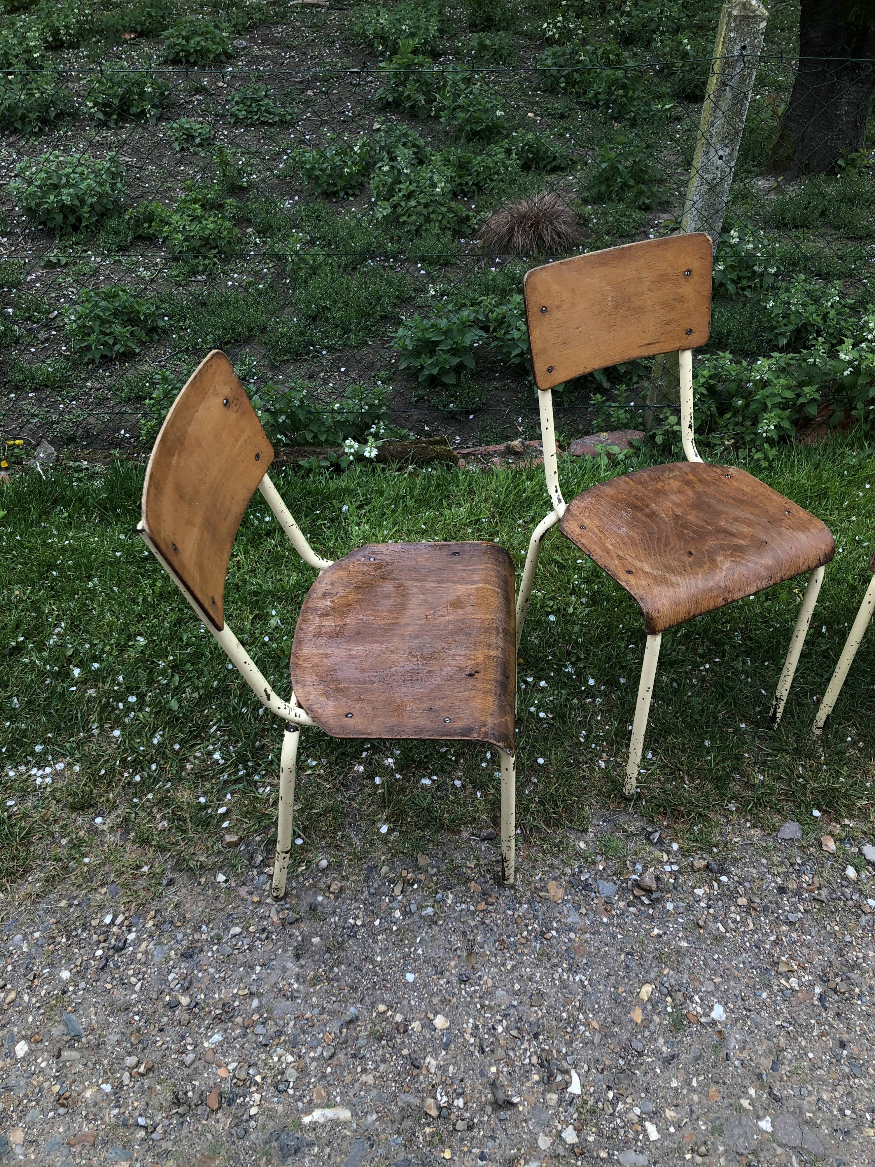 Three vintage school chairs