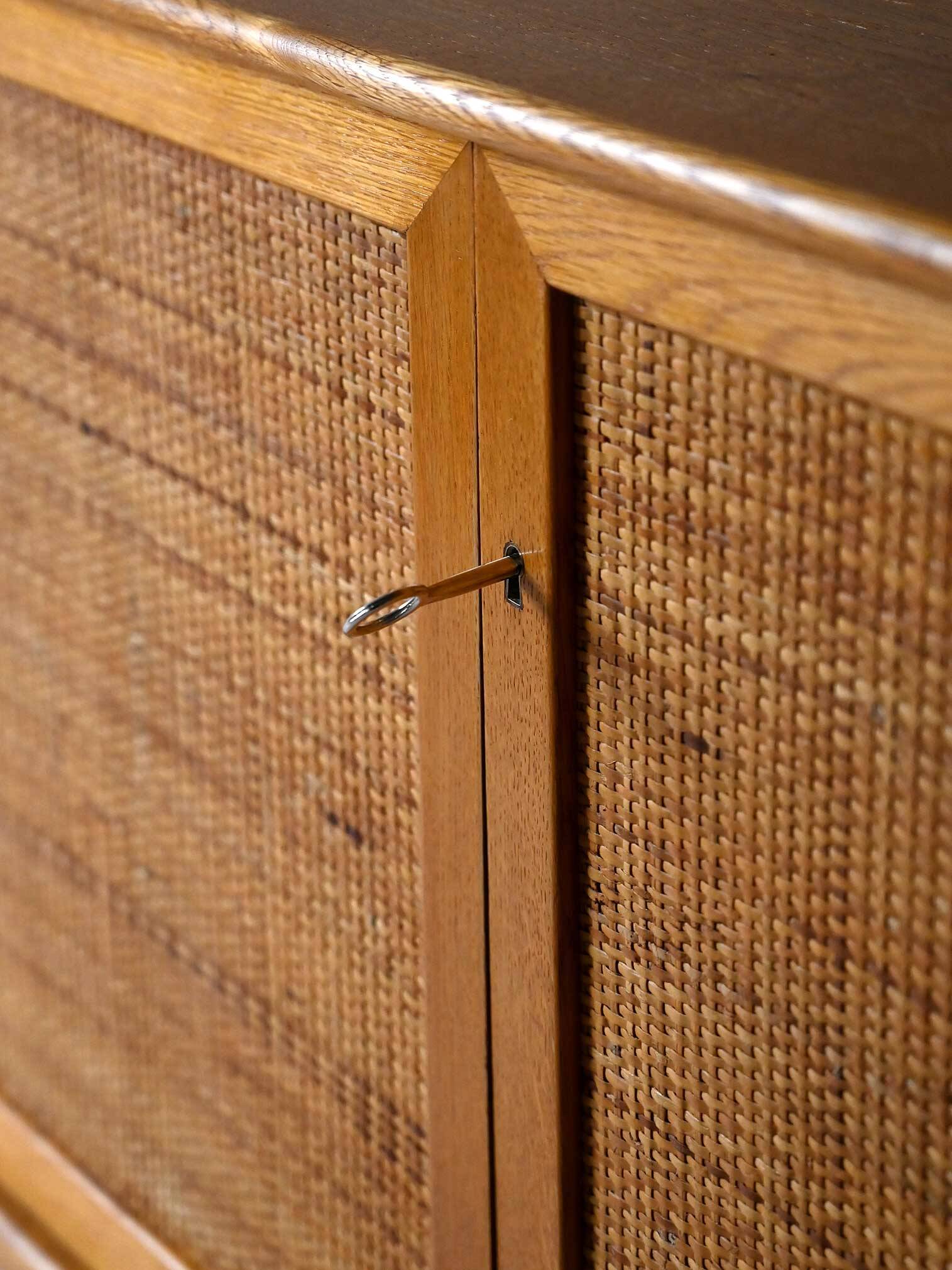 Scandinavian oak cabinet with woven rattan doors