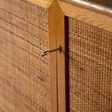 Scandinavian oak cabinet with woven rattan doors