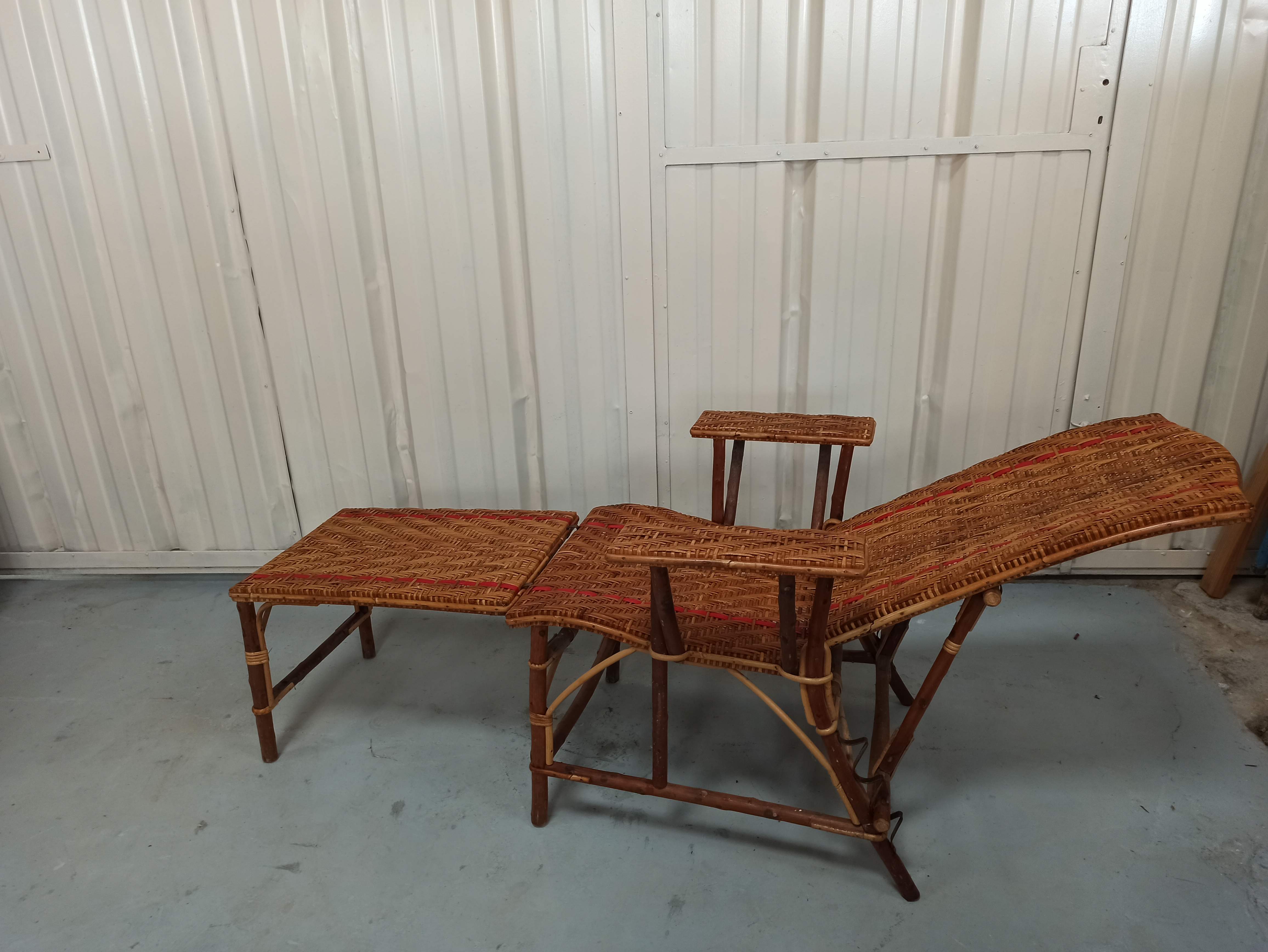 Sunbathing sunbathing in wicker rattan wood deckchair red lounger
