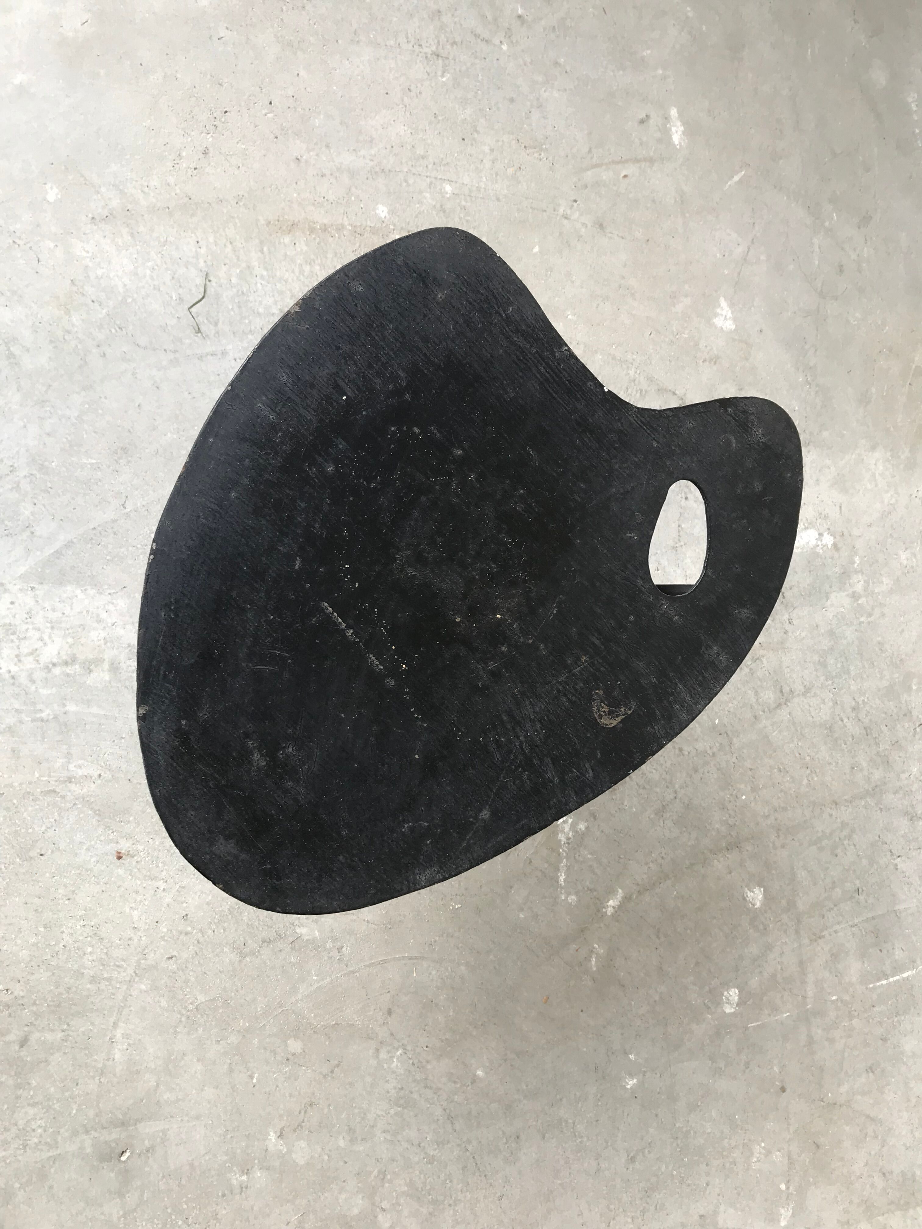 Side table in black lacquered metal, circa 1950.