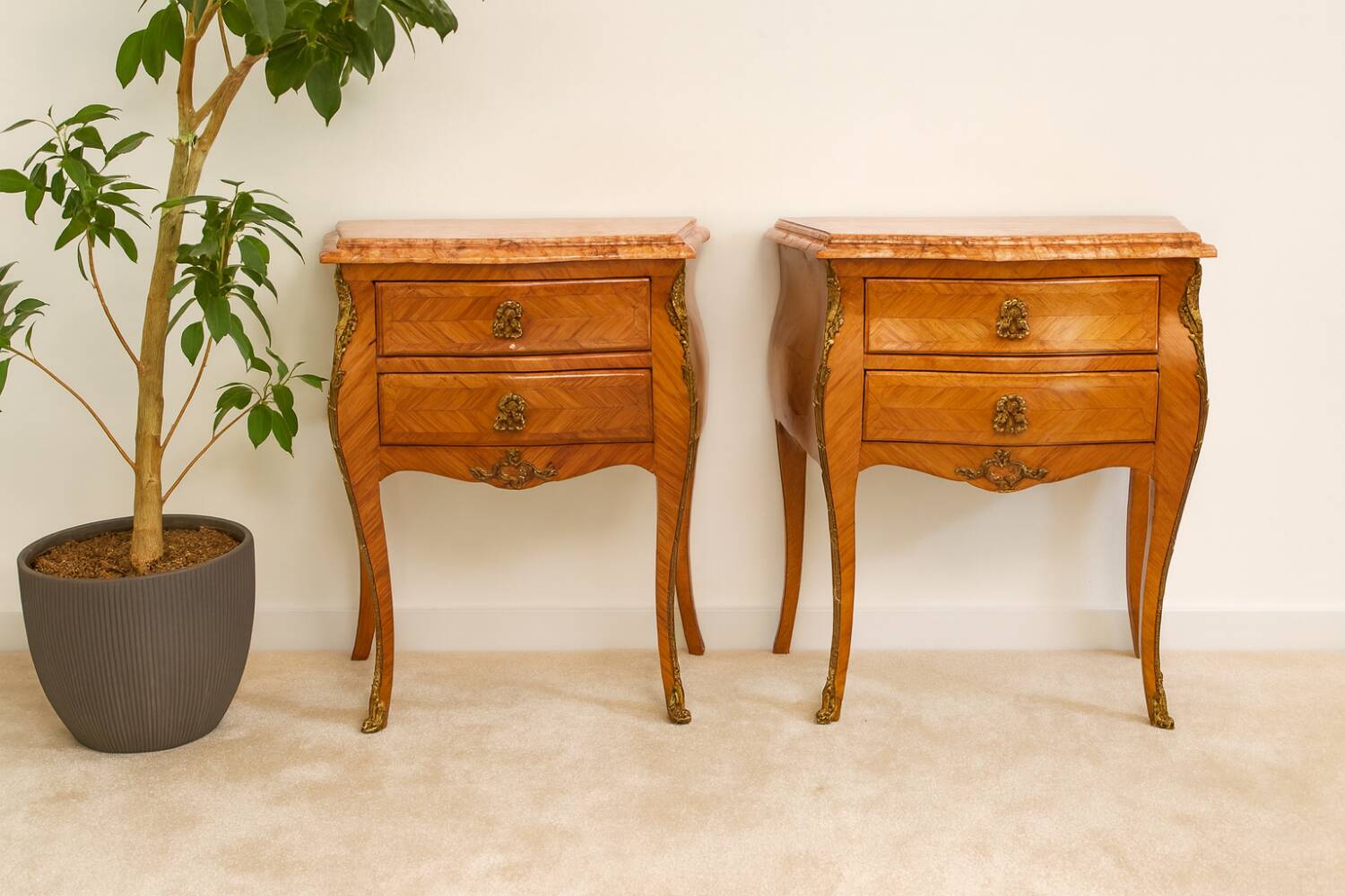 Pair of Louis XV style curved bedside tables in marquetry