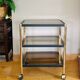 Side table in gold metal and smoked glasses 1970s