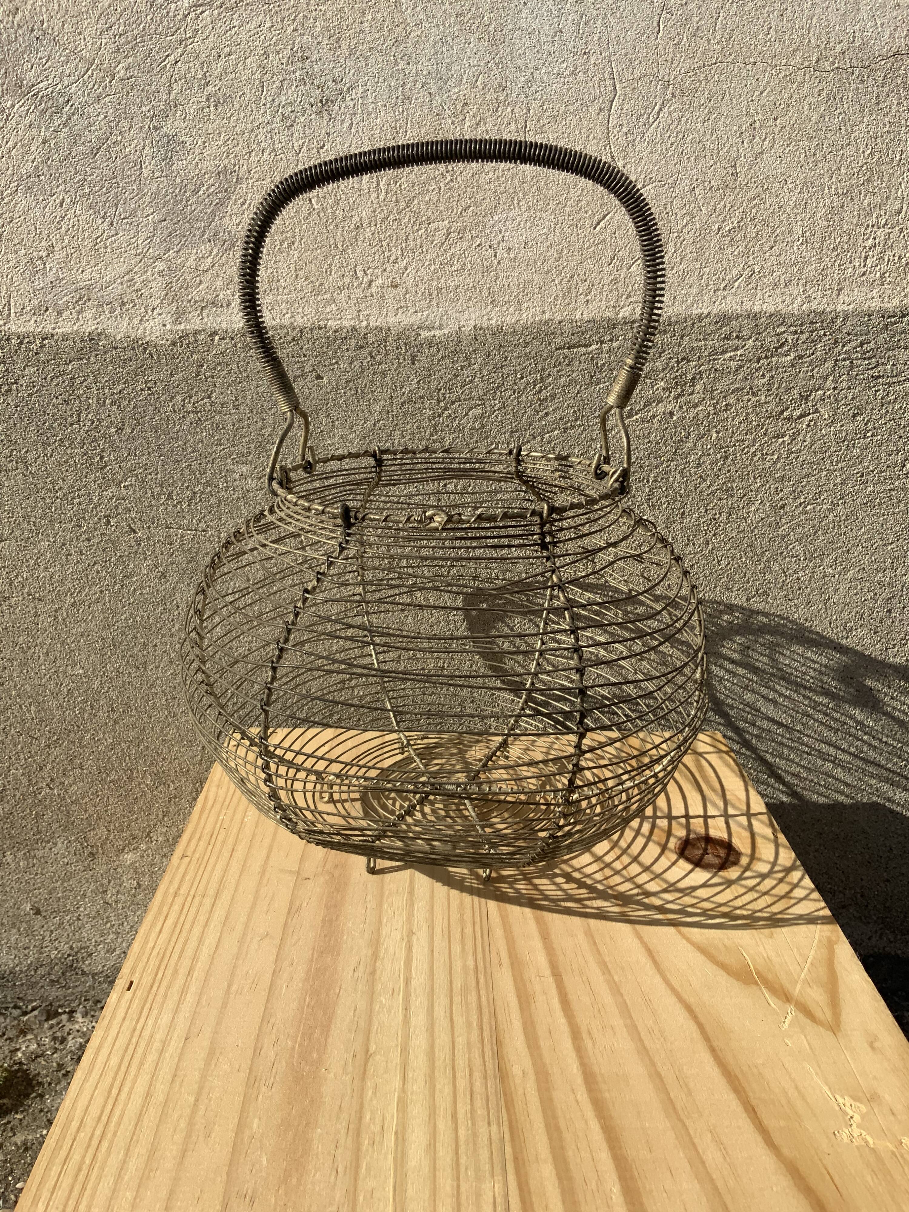 Vintage iron egg basket with hanse antique