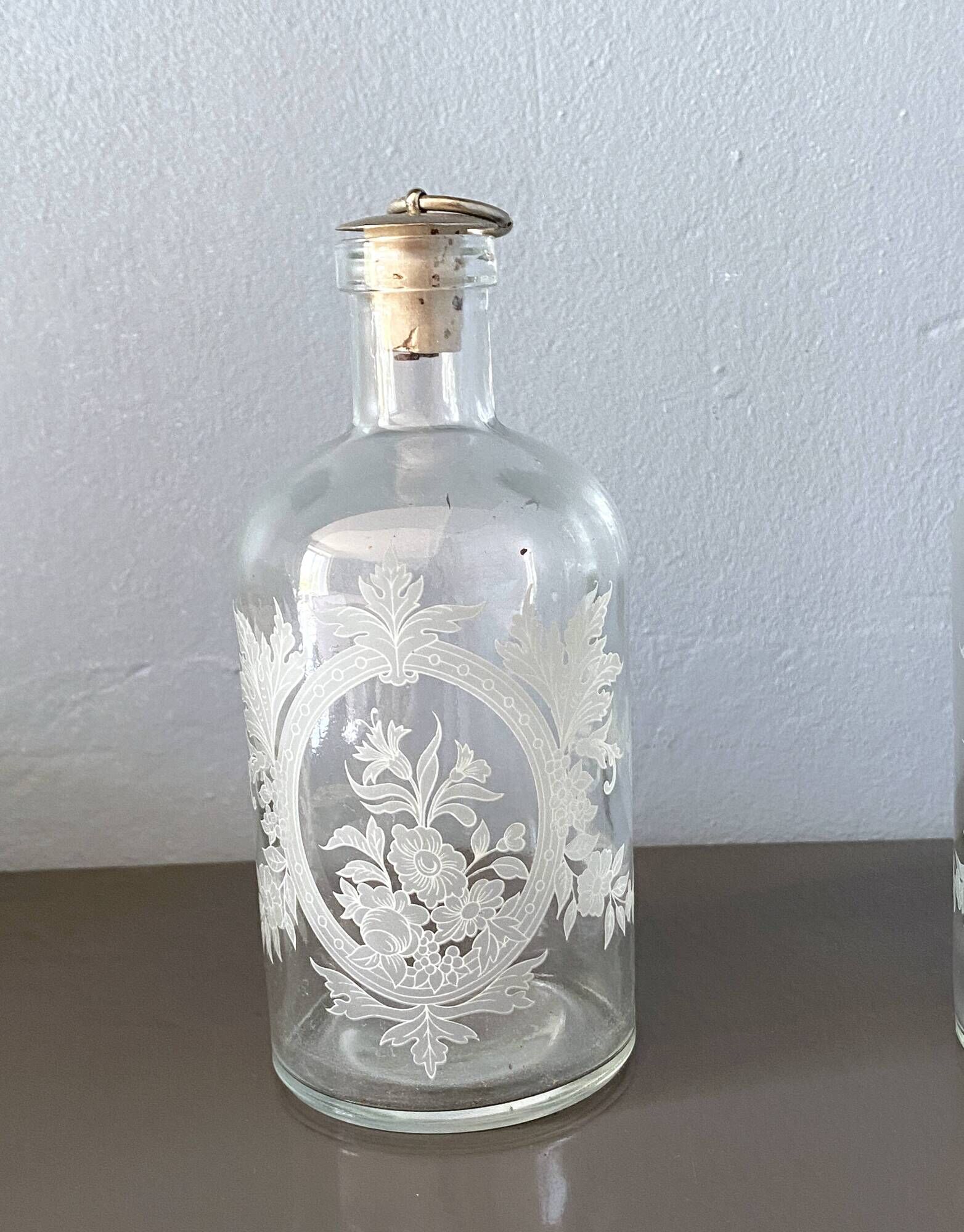 Pair of antique wheel-engraved glass bottles - good condition