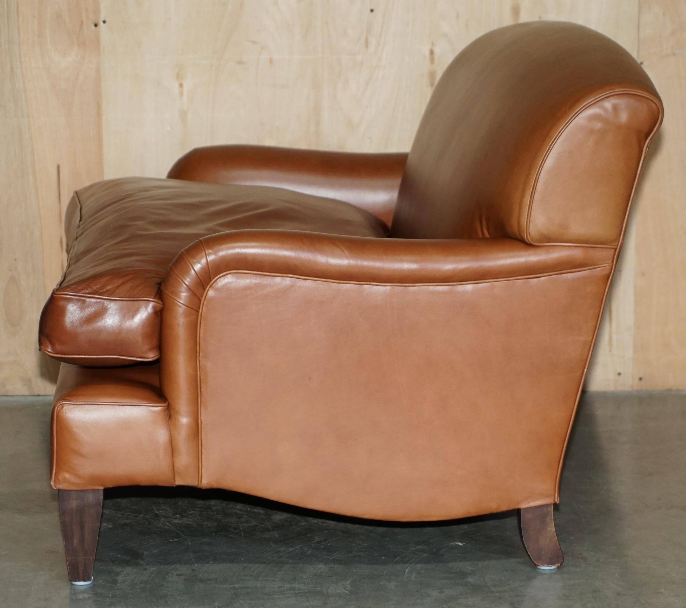 Two-seater leather armchair in Howard style by George Smith.
