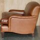 Two-seater leather armchair in Howard style by George Smith.