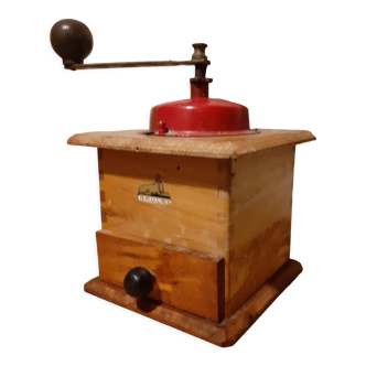 Old Peugeot brand coffee grinder in working order.