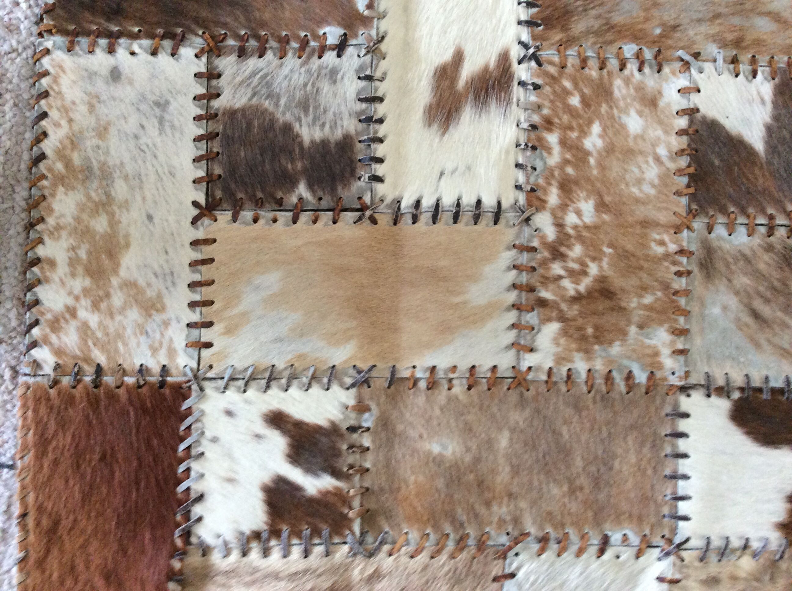 Patchwork carpet in cowhide 164x105cm from the 70s