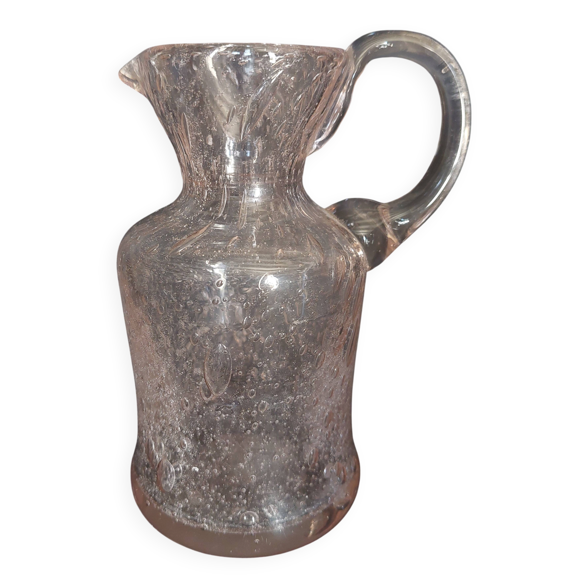 Small blown glass pitcher with bubbles from the 20th century.