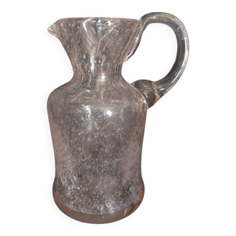 Small blown glass pitcher with bubbles from the 20th century.