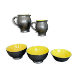 Two pitchers and three Elchinger ceramic bowls black and yellow background 1960