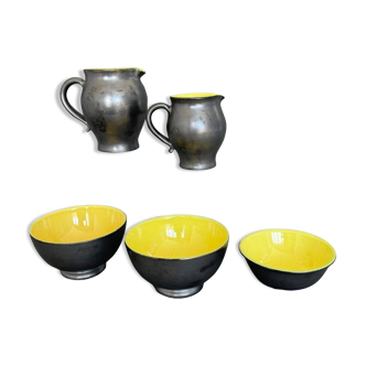 Two pitchers and three Elchinger ceramic bowls black and yellow background 1960