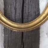 Golden oval frame
