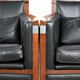 Set of 2 black leather Art Deco design armchairs in good condition