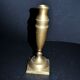 Antique baluster candlestick in bronze with hand-chiseled design.