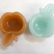 Pair of Apple opalin ashtrays