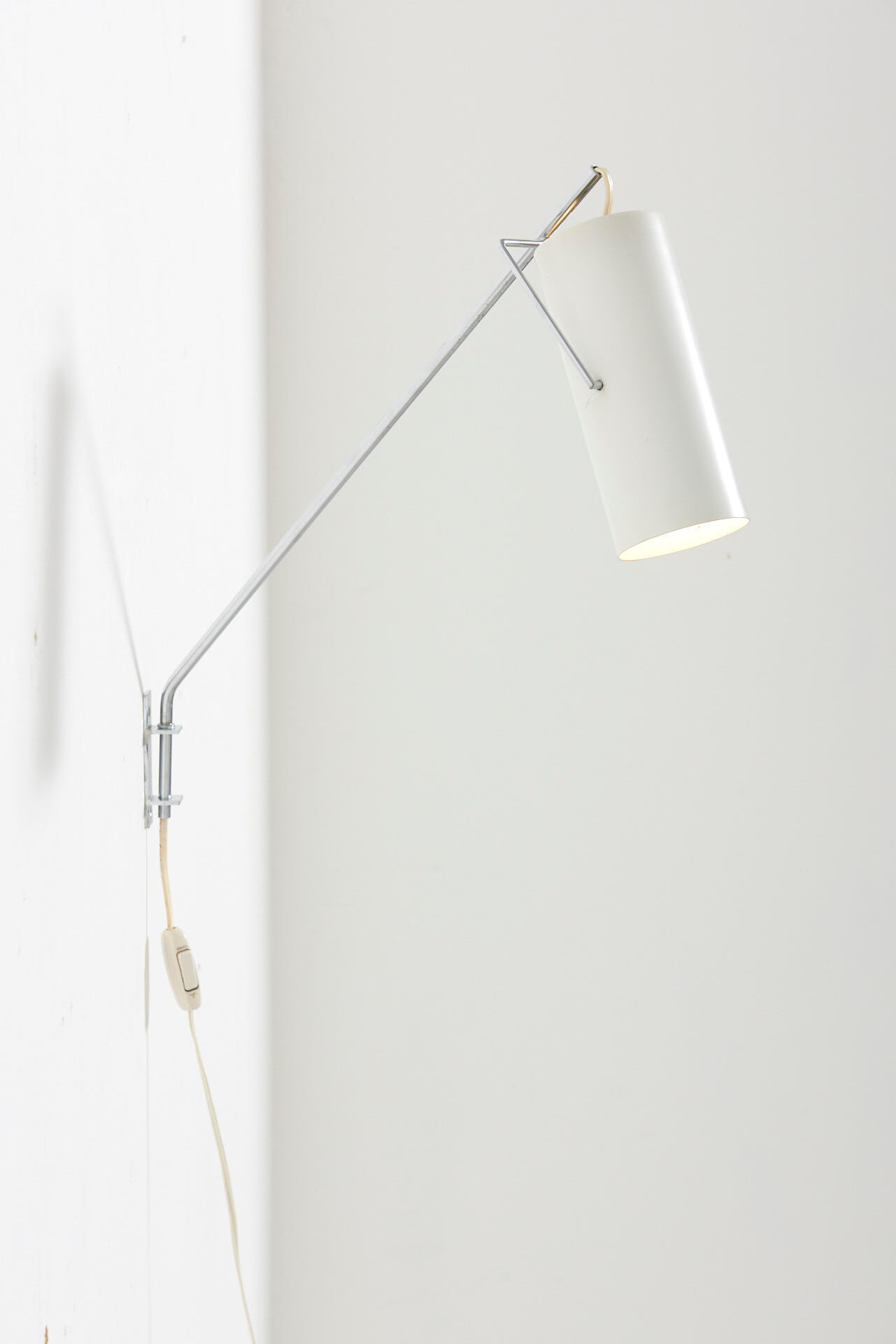 Swinging arm wall lamp by Raak, Netherlands - 1960's