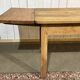 Extendable oak table from the 1930s with Gothic decoration.