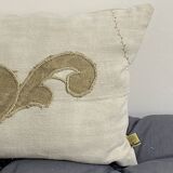 Cushion in vintage fabric with ornamentation