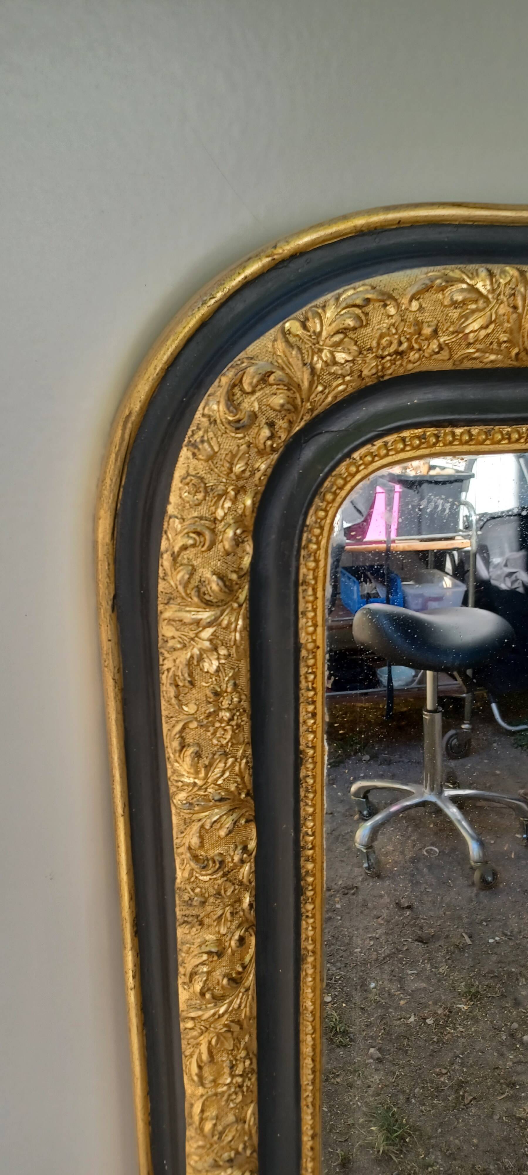 Louis-Philippe mirror, gilded and grey patina, circa 1890.
