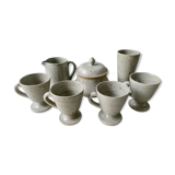 Set of 4 cups, 1 mazagran, 1 milk pot and 1 sugar bowl in pyrity sandstone, signed